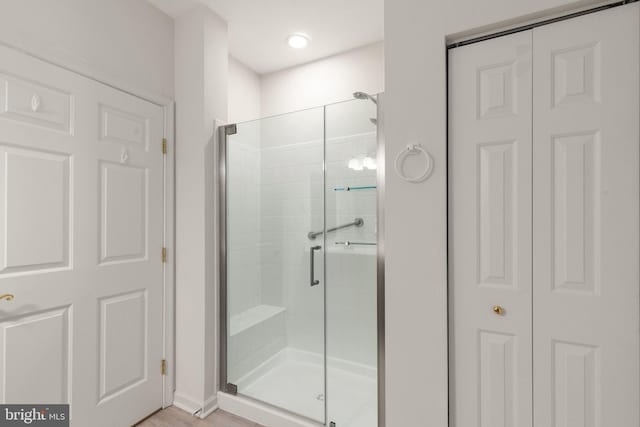 bathroom featuring an enclosed shower