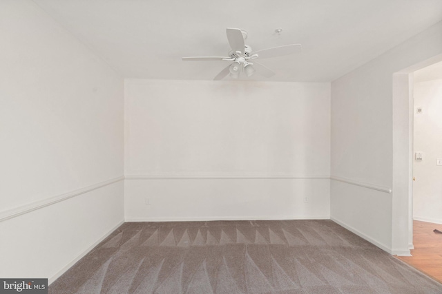 unfurnished room featuring ceiling fan and carpet floors