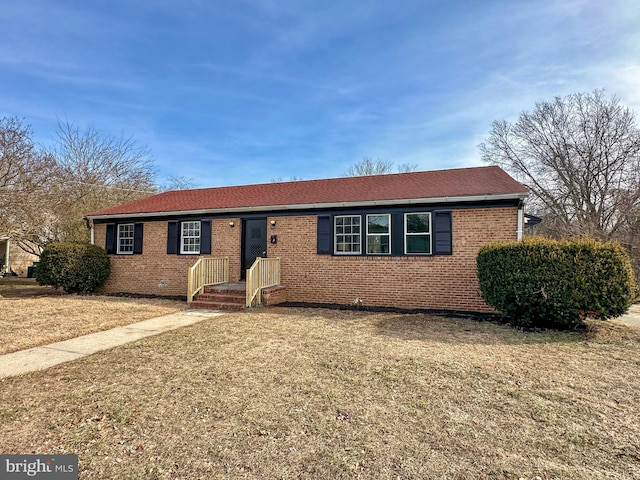 ranch-style house with a front lawn