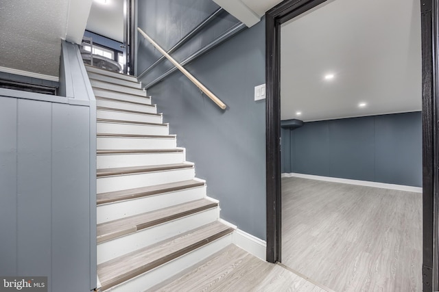 stairs with wood-type flooring