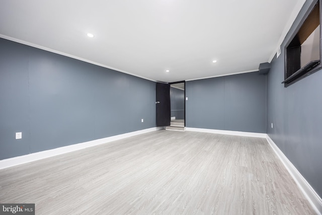 interior space with ornamental molding and light wood-type flooring