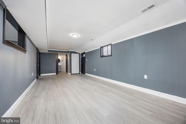 basement featuring light hardwood / wood-style floors