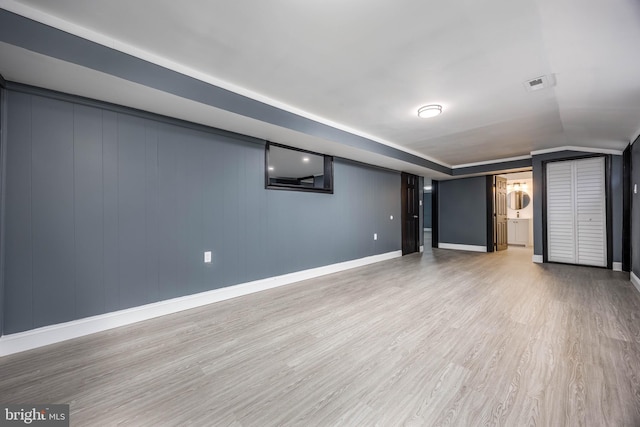 basement with light wood-type flooring