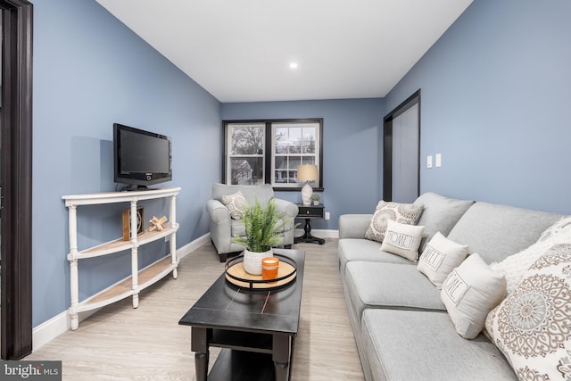 living room with light hardwood / wood-style flooring