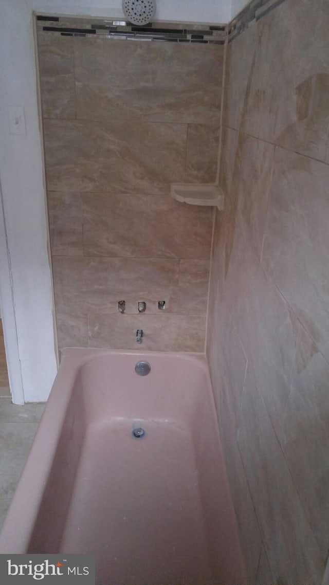 bathroom featuring shower with separate bathtub