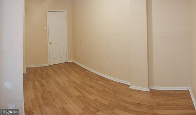 spare room featuring light hardwood / wood-style floors