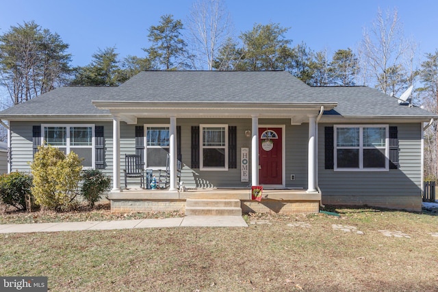 view of front of property with a front lawn and covered porch