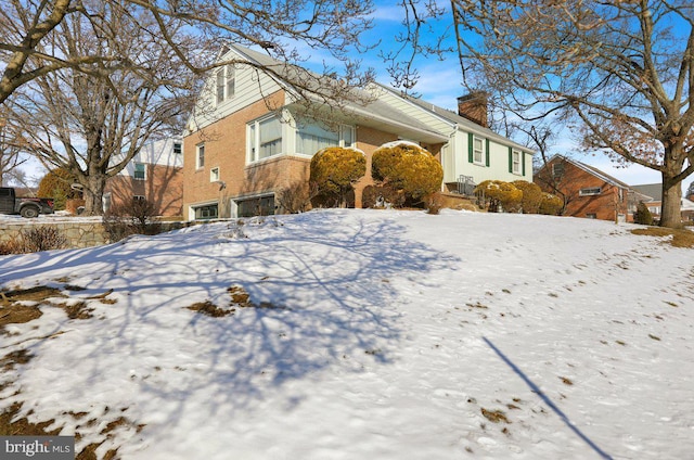 view of snow covered property