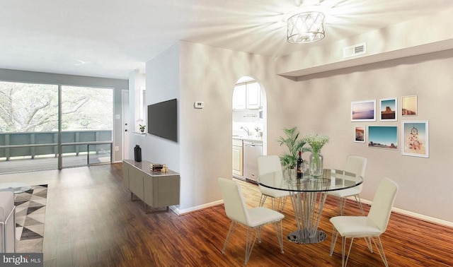 dining area featuring dark hardwood / wood-style flooring and sink