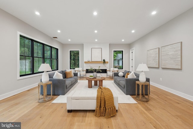 6919 Berkeley St, Falls Church, VA 22043 - living room with light wood finished floors, recessed lighting, and baseboards
