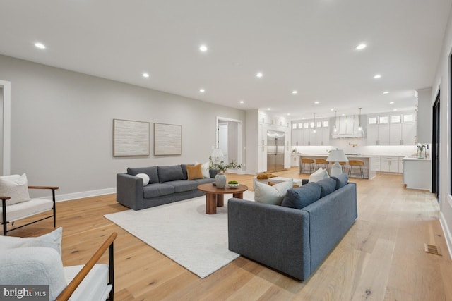 6919 Berkeley St, Falls Church, VA 22043 - living area featuring light wood-style flooring, recessed lighting, and baseboards