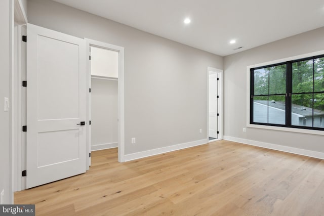 6919 Berkeley St, Falls Church, VA 22043 - unfurnished bedroom with light wood-type flooring, recessed lighting, a spacious closet, and baseboards