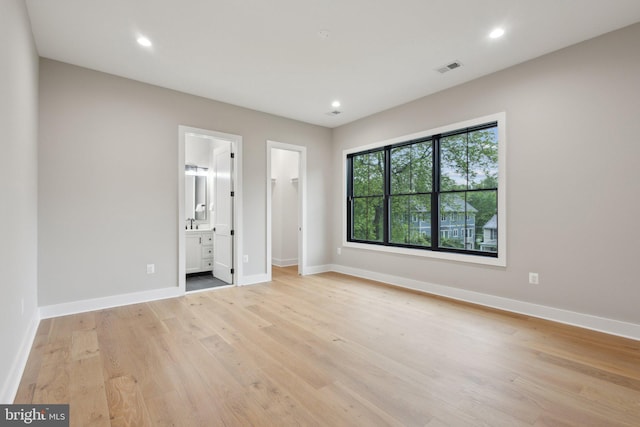 6919 Berkeley St, Falls Church, VA 22043 - unfurnished bedroom featuring light wood-style floors, a walk in closet, baseboards, recessed lighting, and ensuite bath