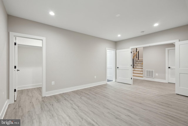 6919 Berkeley St, Falls Church, VA 22043 - empty room with light wood-type flooring, stairs, recessed lighting, and baseboards