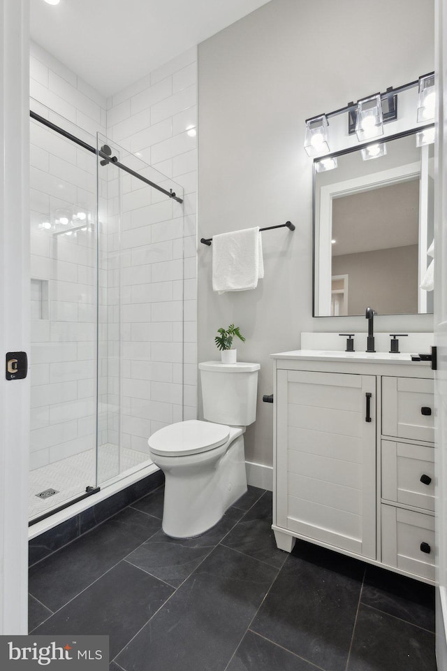 6919 Berkeley St, Falls Church, VA 22043 - bathroom featuring toilet, a shower stall, vanity, and baseboards