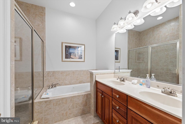 bathroom with tile patterned floors, vanity, and independent shower and bath