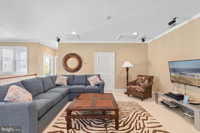 living room with ornamental molding and light carpet