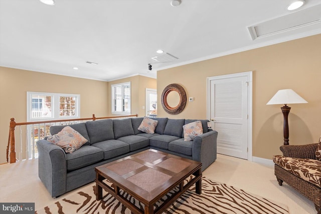 living room featuring crown molding and light colored carpet