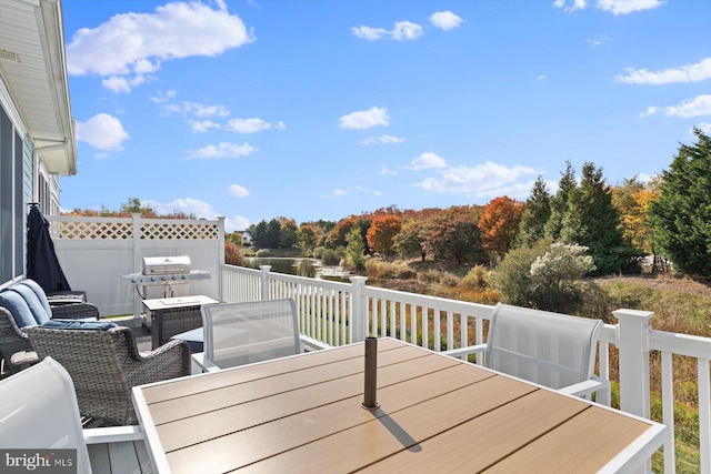 deck featuring an outdoor living space and grilling area