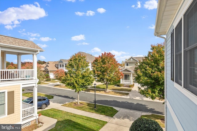 view of yard with a balcony