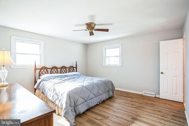 bedroom with ceiling fan and light hardwood / wood-style flooring