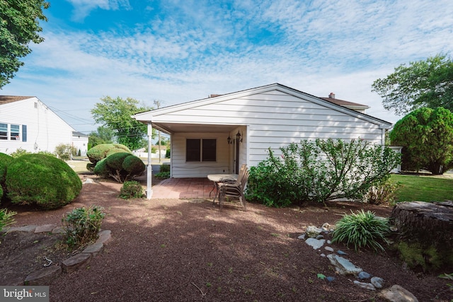 rear view of property featuring a patio