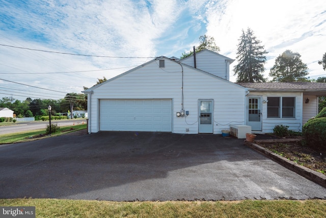 view of property exterior with a garage