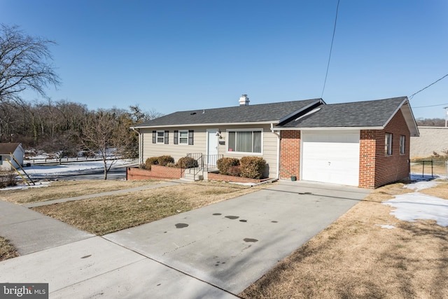 ranch-style home with a garage and a front lawn