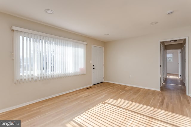 unfurnished room featuring light wood-type flooring