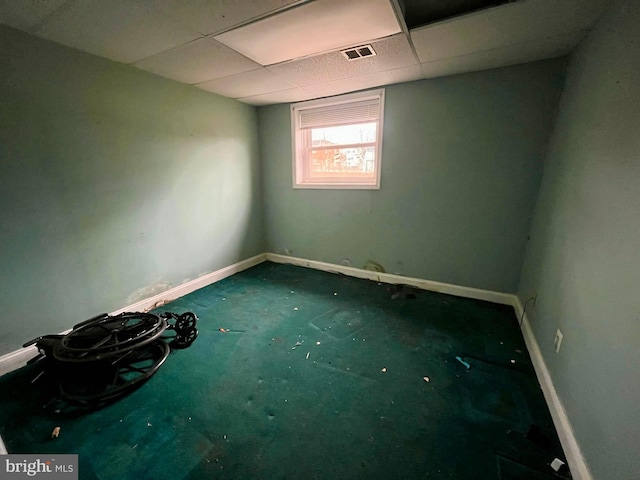 spare room featuring a paneled ceiling