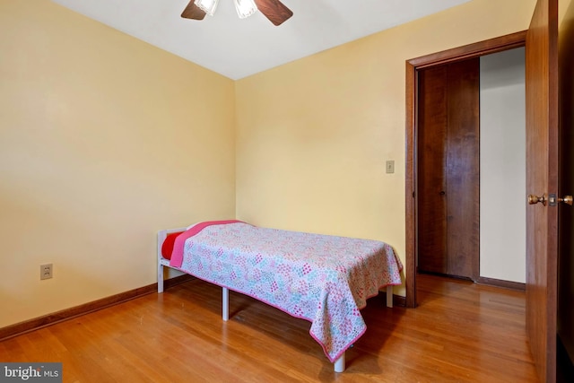 bedroom featuring hardwood / wood-style floors and ceiling fan