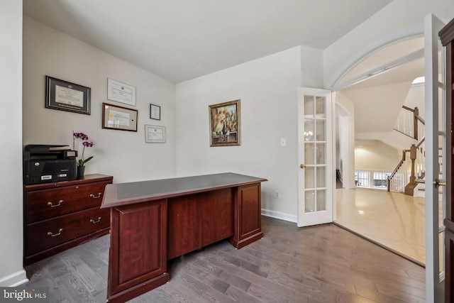 office area with dark wood-type flooring and french doors