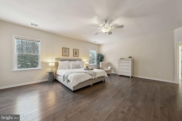 bedroom with dark wood-type flooring and ceiling fan