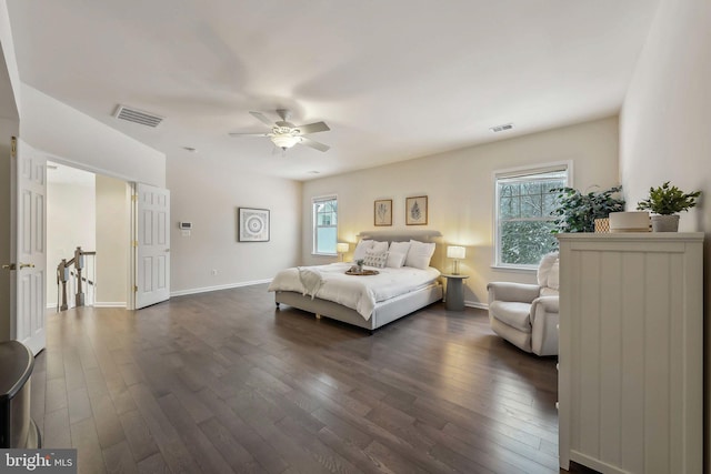 bedroom with dark wood-type flooring and ceiling fan