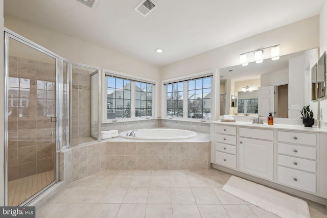 bathroom with vanity, separate shower and tub, and tile patterned flooring