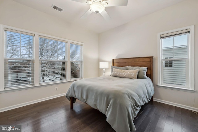 bedroom featuring ceiling fan and dark hardwood / wood-style flooring