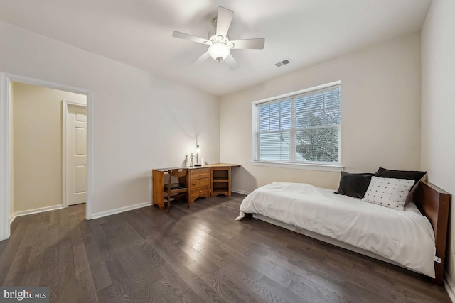 bedroom featuring dark wood-type flooring and ceiling fan