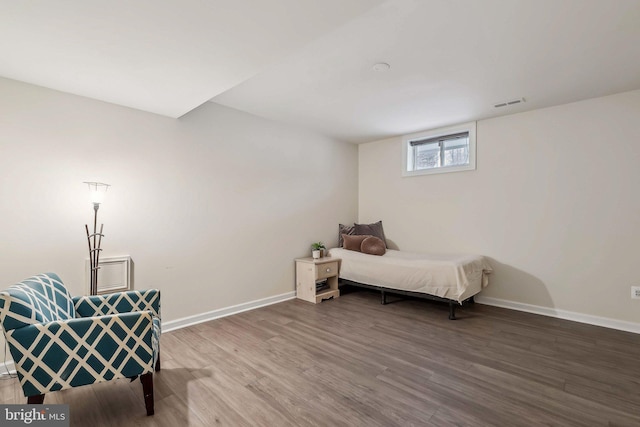 bedroom with wood-type flooring