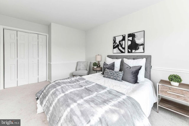 carpeted bedroom featuring a closet