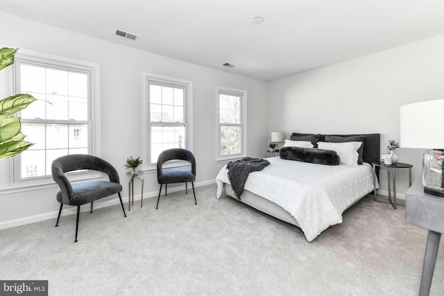 bedroom with light colored carpet