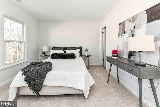 bedroom with light colored carpet