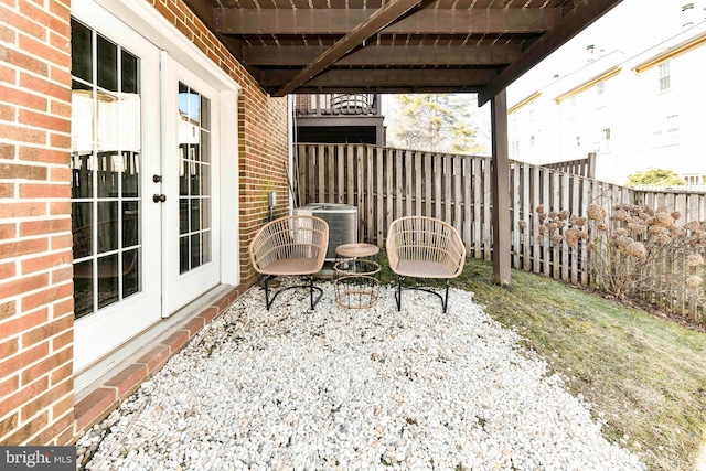 view of patio / terrace featuring french doors and central air condition unit