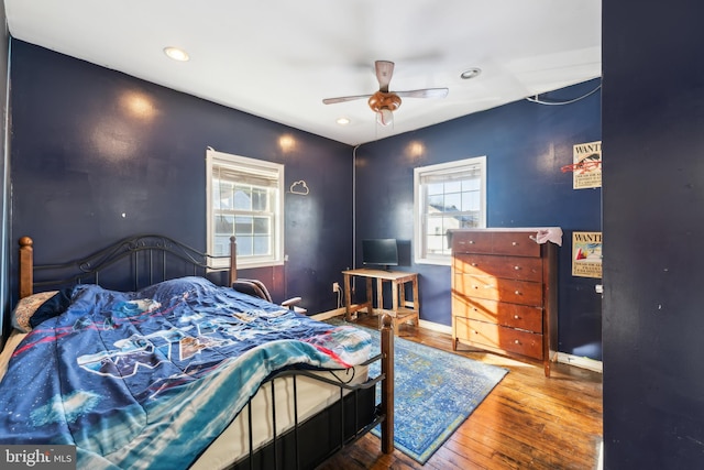 bedroom with hardwood / wood-style flooring and ceiling fan