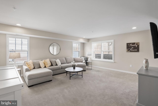 carpeted living room featuring a healthy amount of sunlight