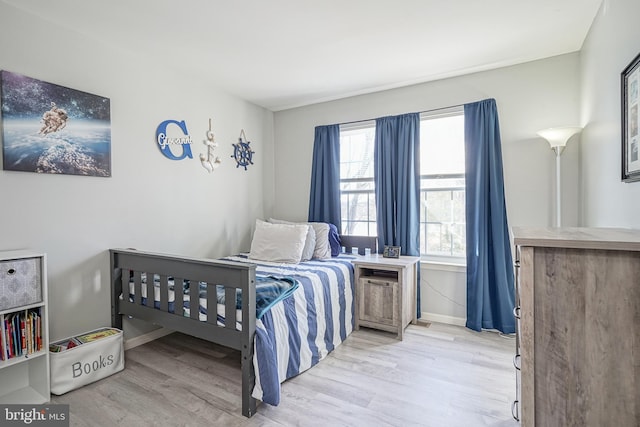 bedroom with light hardwood / wood-style floors