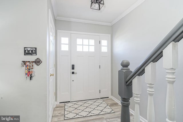 foyer featuring crown molding and light wood-type flooring