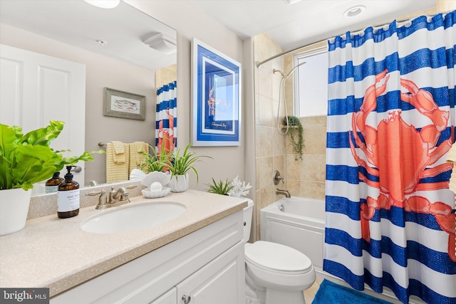 full bathroom with shower / bath combo, vanity, and toilet