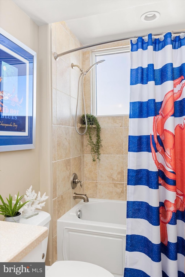 full bathroom featuring toilet, vanity, and shower / tub combo