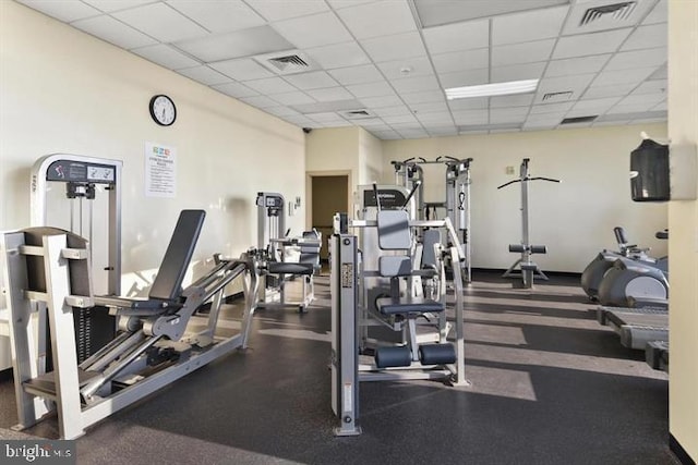 workout area featuring a drop ceiling