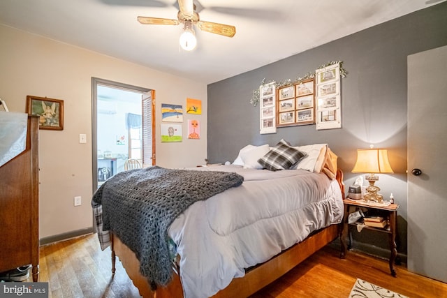 bedroom featuring light hardwood / wood-style floors and ceiling fan